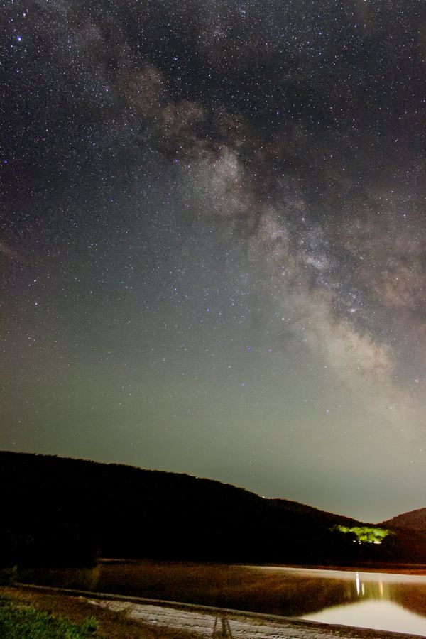 The Milky Way core rising above a lake