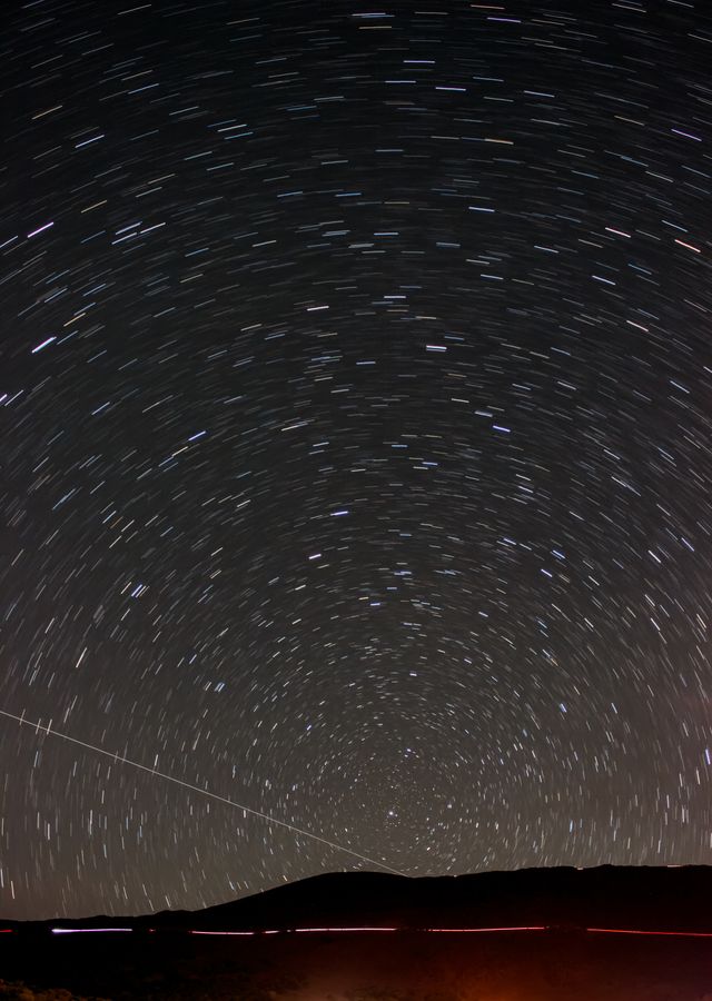 Star trails circling the north celestial pole above Mauna Kea
