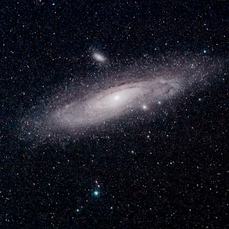The Andromeda Galaxy with its dust lanes and satellite galaxies