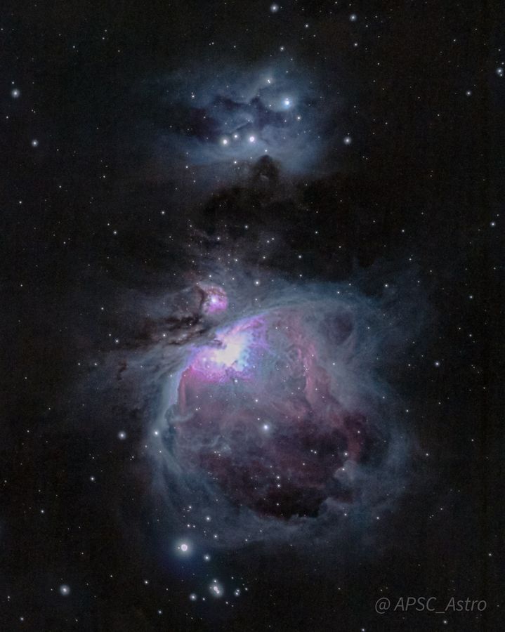 The Orion Nebula in pink and blue, with the Running Man Nebula above it